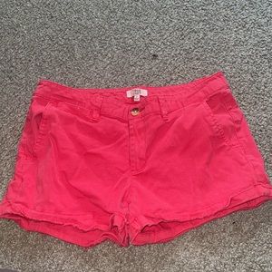 A pair of red Jean shorts.